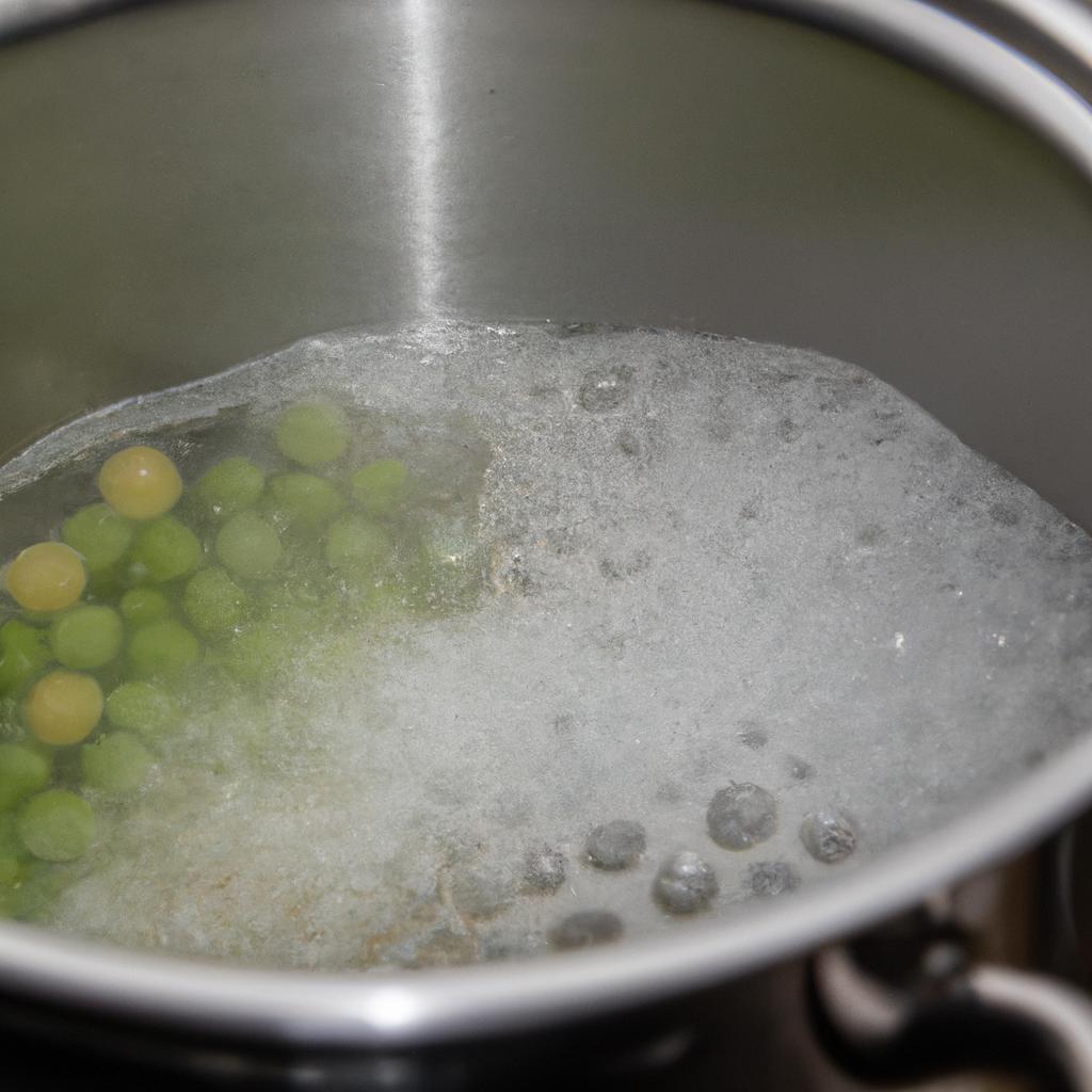 Blanching peas in boiling water is one of the methods for freezing.