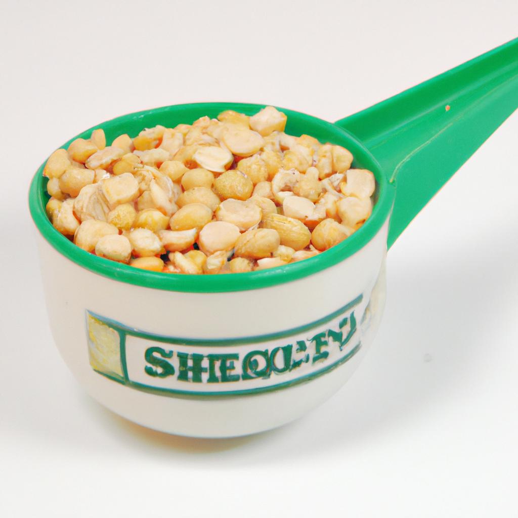A measuring cup full of shelled peas, the perfect amount for a recipe