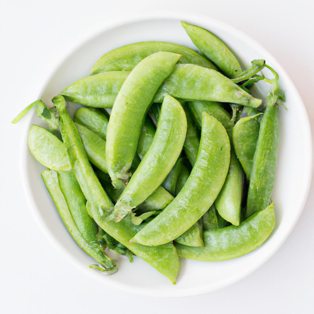 A close-up shot of a bowl of fresh snap peas, showcasing their nutritional content.
