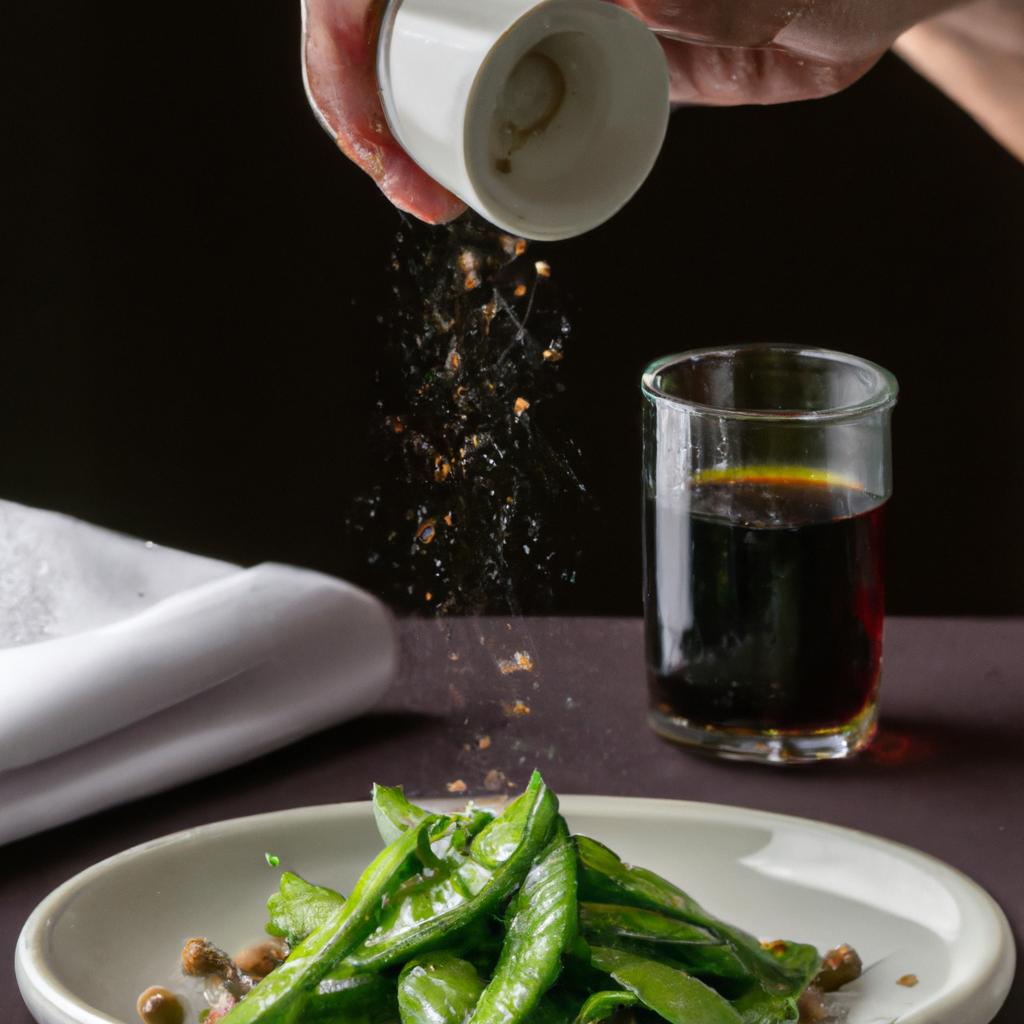 Drizzling soy sauce over sautéed snow peas adds a savory umami flavor to the dish.